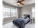 Comfortable bedroom with large windows and stylish bedding at 5789 Echo Park Cir, Castle Rock, CO 80104
