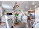 Open dining area with seating for six, seamlessly connecting the living room and kitchen at 5789 Echo Park Cir, Castle Rock, CO 80104