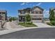 Charming two-story home featuring stone accents, a two-car garage, and manicured front yard at 5789 Echo Park Cir, Castle Rock, CO 80104