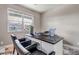 Bright home office with modern desk, comfortable chairs, and lots of natural light at 5789 Echo Park Cir, Castle Rock, CO 80104