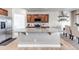 Kitchen island features granite countertops, stylish fixtures, and seating area. The dining area is visible behind it at 5789 Echo Park Cir, Castle Rock, CO 80104