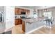 Open kitchen featuring an island with granite countertops, modern appliances, and hardwood floors at 5789 Echo Park Cir, Castle Rock, CO 80104