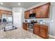 Well-lit kitchen with stainless steel appliances, a kitchen island and wooden cabinets at 5789 Echo Park Cir, Castle Rock, CO 80104