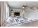 Comfortable living room with a large sectional sofa, wooden floors, and a ceiling fan at 5789 Echo Park Cir, Castle Rock, CO 80104