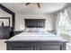 Close up of a main bedroom featuring a statement headboard and two bedside tables at 5789 Echo Park Cir, Castle Rock, CO 80104