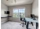Office area with large window, a gray glass desk and modern computer at 5789 Echo Park Cir, Castle Rock, CO 80104