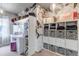 A stylish walk-in closet featuring decorative wallpaper, open shelving and vanity at 5789 Echo Park Cir, Castle Rock, CO 80104