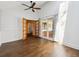 Open bedroom layout featuring hardwood floors, ceiling fan, and sliding door to the deck at 2733 S Riverview Dr, Idledale, CO 80453