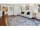 Inviting living room with a comfortable sofa, hardwood floors, and a stylish rug at 2733 S Riverview Dr, Idledale, CO 80453