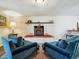 Comfortable living room featuring a fireplace and cozy seating arrangement at 2733 S Riverview Dr, Idledale, CO 80453