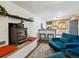 Inviting space featuring a wood burning stove, kitchen, and comfortable seating at 2733 S Riverview Dr, Idledale, CO 80453