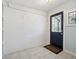 Mud room featuring a white brick wall and a black door to the exterior at 2733 S Riverview Dr, Idledale, CO 80453