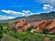 Scenic view of Red Rocks Amphitheater park landscape in Colorado with native vegetation, mountains, and blue sky at 2733 S Riverview Dr, Idledale, CO 80453