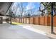 Spacious backyard with basketball court and wooden fence at 245 Fair Pl, Boulder, CO 80302