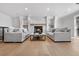Finished basement with two sofas, a fireplace, and hardwood floors at 245 Fair Pl, Boulder, CO 80302