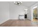 Bedroom with hardwood floors, shiplap wall, and private bath access at 245 Fair Pl, Boulder, CO 80302