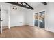 Spacious bedroom with hardwood floors and sliding glass door to deck at 245 Fair Pl, Boulder, CO 80302