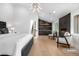 Luxury bedroom with sitting area, fireplace, and private wet bar at 245 Fair Pl, Boulder, CO 80302