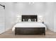 Bright bedroom with a dark wood platform bed and large window at 245 Fair Pl, Boulder, CO 80302