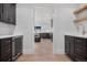 Butlers pantry with beverage cooler, sink, and ample storage at 245 Fair Pl, Boulder, CO 80302