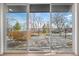 Deck with wicker furniture and a view of the backyard and trees beyond at 245 Fair Pl, Boulder, CO 80302