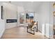 Sunlit entryway with hardwood floors, a modern fireplace, and leather chairs at 245 Fair Pl, Boulder, CO 80302
