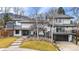 Beautiful contemporary home with a white exterior, modern design, and landscaping at 245 Fair Pl, Boulder, CO 80302