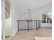 Modern hallway with light fixtures, metal railing, and hardwood floors at 245 Fair Pl, Boulder, CO 80302