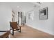 Bright landing with spiral staircase, hardwood floors, and large window at 245 Fair Pl, Boulder, CO 80302