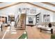 Spacious living room with wood staircase, beamed ceilings, and open floor plan at 245 Fair Pl, Boulder, CO 80302
