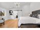 Spacious main bedroom with a king-size bed and ensuite bathroom access at 245 Fair Pl, Boulder, CO 80302