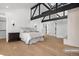 Primary bedroom featuring a king-size bed, hardwood floors, and a modern dresser at 245 Fair Pl, Boulder, CO 80302