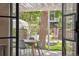 Outdoor patio with a dining area and a tree swing overlooking the backyard at 2844 Quitman St, Denver, CO 80212