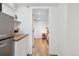 Cozy kitchenette leading to a bedroom, complete with modern appliances and a comfortable sleeping area at 2844 Quitman St, Denver, CO 80212