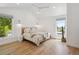 Bright bedroom with vaulted ceilings, two large windows, hardwood floors, and stylish decor at 2844 Quitman St, Denver, CO 80212
