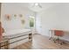 Bright bedroom with hardwood floors, a desk and storage at 2844 Quitman St, Denver, CO 80212