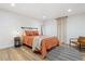 Comfortable bedroom featuring a rustic bed frame with a view of natural lighting at 2844 Quitman St, Denver, CO 80212