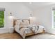 Beautiful bedroom with modern lighting, hardwood floors, neutral decor, and plenty of natural light at 2844 Quitman St, Denver, CO 80212