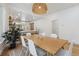 Open concept dining room with a wood table, seating for six, and easy access to the kitchen at 2844 Quitman St, Denver, CO 80212