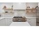 Bright kitchen featuring white cabinetry, quartz countertops, and stainless steel appliances at 2844 Quitman St, Denver, CO 80212