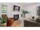 Cozy living room with a fireplace, large TV, and comfortable seating at 2844 Quitman St, Denver, CO 80212