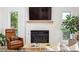 Cozy living room with fireplace, flat screen television, and comfortable seating at 2844 Quitman St, Denver, CO 80212