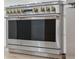 Close-up of a stainless steel Monogram oven with brass accents and a modern design at 2844 Quitman St, Denver, CO 80212