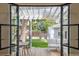 Covered patio with outdoor seating and dining area, providing a great view of the backyard at 2844 Quitman St, Denver, CO 80212
