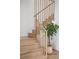 Bright staircase with hardwood floors and a modern railing at 2844 Quitman St, Denver, CO 80212