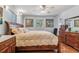 Bedroom featuring a queen-sized bed, hardwood floors, and natural light at 1744 S Leyden St, Denver, CO 80224