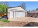 Detached two-car garage with an additional side door and long driveway at 1744 S Leyden St, Denver, CO 80224