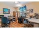 Office space with dual desks, hardwood flooring, and window views at 1744 S Leyden St, Denver, CO 80224