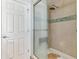 Shower with glass door and mosaic tile accent at 1744 S Leyden St, Denver, CO 80224