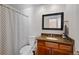 Clean bathroom with shower, toilet and granite vanity at 6817 S Webster St # C, Littleton, CO 80128